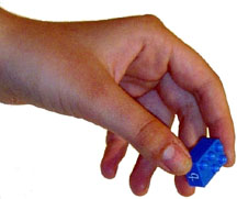 Picture of TACK-TILES&REG in pincer grasp